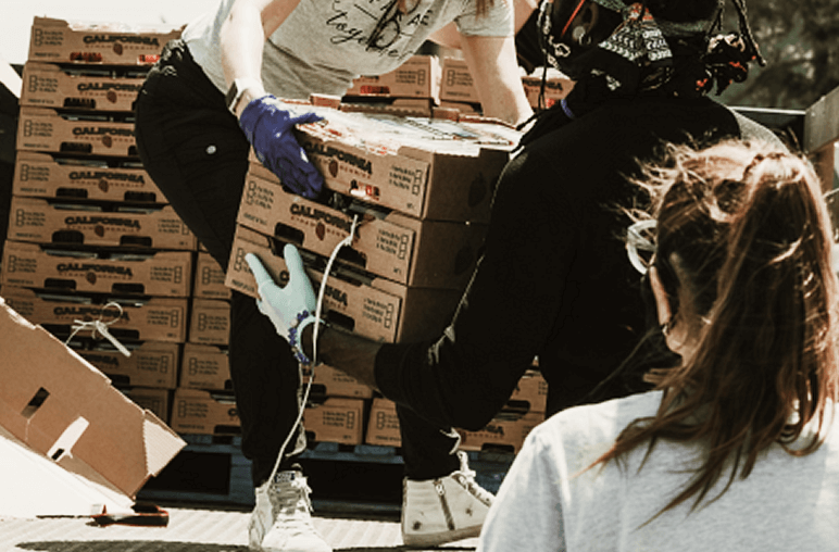 Volunteers helping sort and collect food