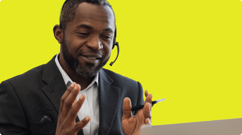 Man on a video call with a volunteer Man on a video call with a volunteer